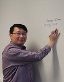 George Chan signing the wall
